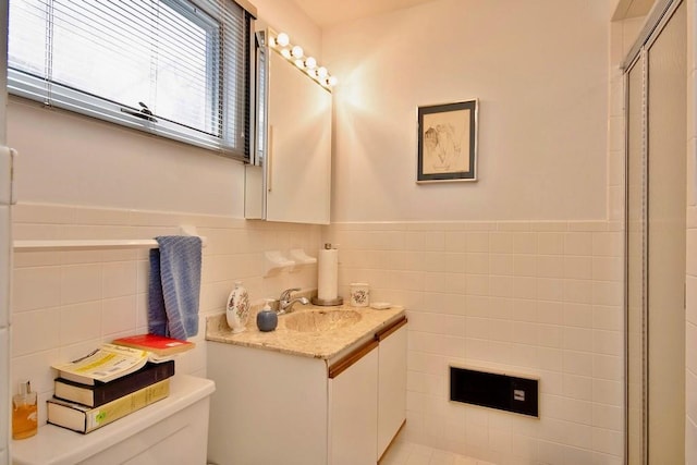 181 Starlight Rd, Monticello, NY 12701 - bathroom featuring vanity, a stall shower, toilet, and tile walls