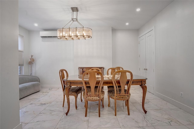 dining room featuring an AC wall unit and an inviting chandelier