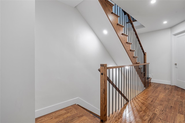 stairway featuring hardwood / wood-style flooring