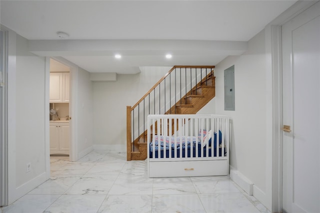 stairs featuring electric panel