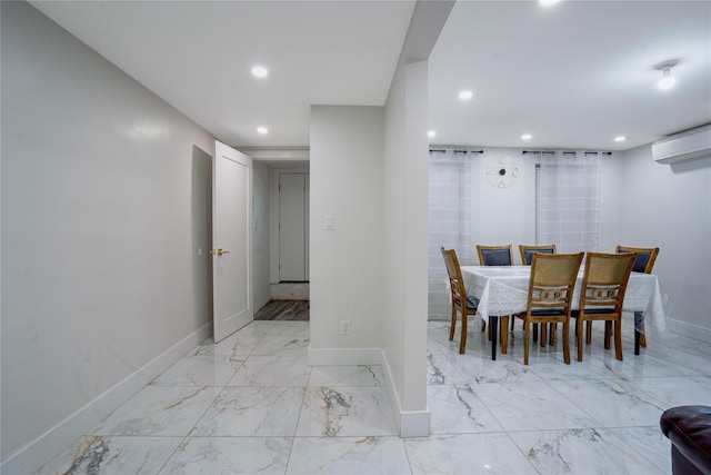 dining area featuring a wall mounted AC