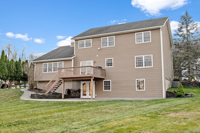 back of house with a yard, central air condition unit, a patio, and a wooden deck