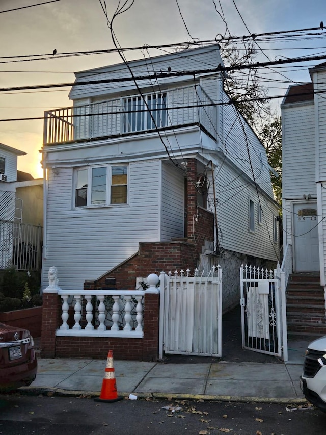 view of front of home with a balcony