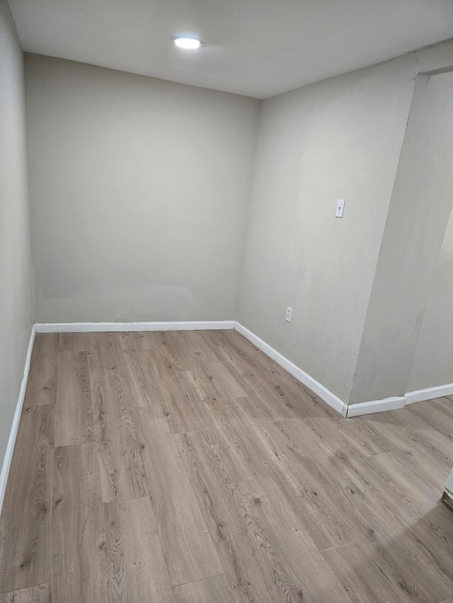 spare room with light hardwood / wood-style floors