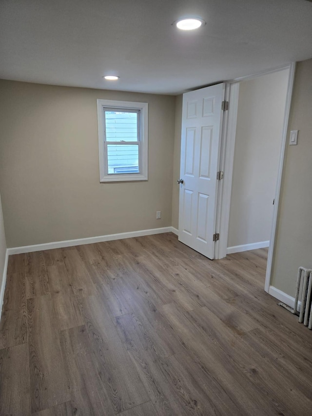 spare room with light hardwood / wood-style floors