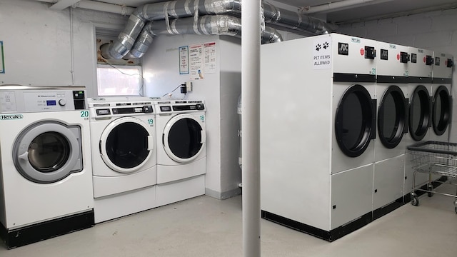 clothes washing area featuring washer and dryer