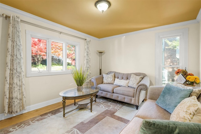 living room featuring light wood-type flooring and ornamental molding