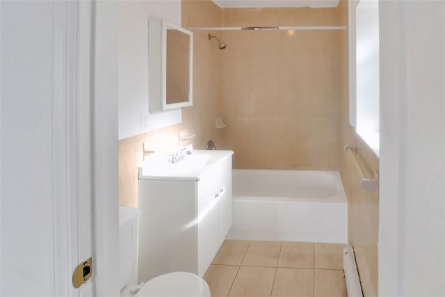 full bathroom with vanity, tiled shower / bath, tile patterned flooring, toilet, and a baseboard radiator