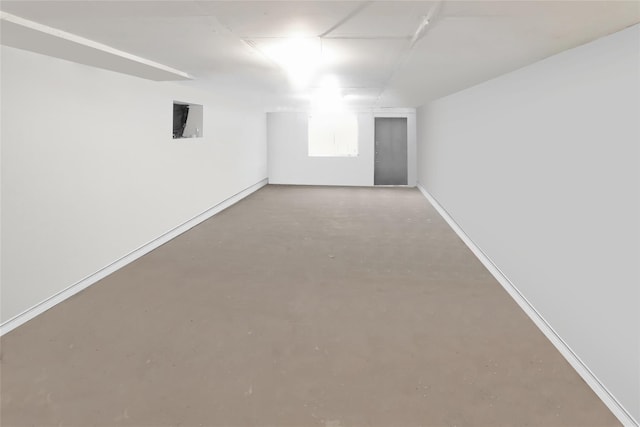 empty room with concrete flooring