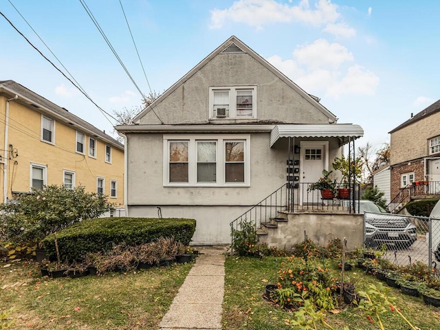 bungalow with a front lawn