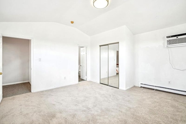 unfurnished bedroom featuring light carpet, baseboard heating, vaulted ceiling, and a wall mounted AC