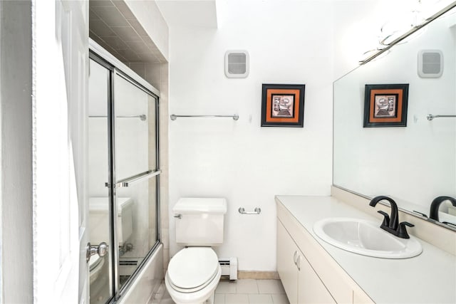 full bathroom featuring vanity, a baseboard heating unit, tile patterned floors, toilet, and enclosed tub / shower combo