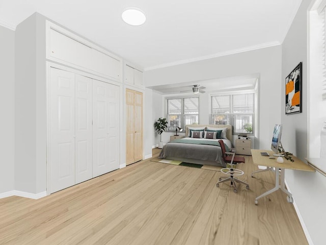 bedroom featuring light hardwood / wood-style floors and crown molding