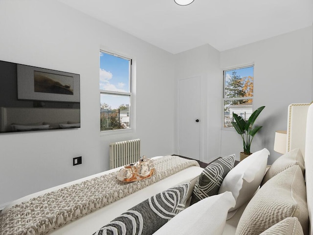 bedroom featuring radiator