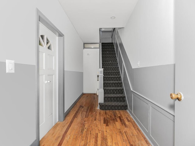 staircase featuring hardwood / wood-style floors