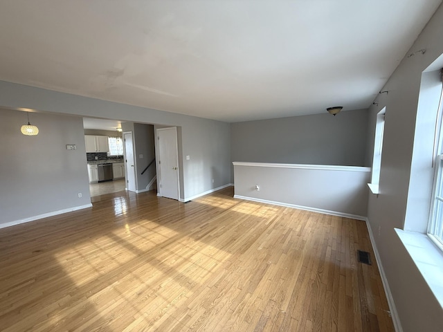 unfurnished living room with light hardwood / wood-style floors