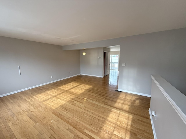 spare room with hardwood / wood-style flooring