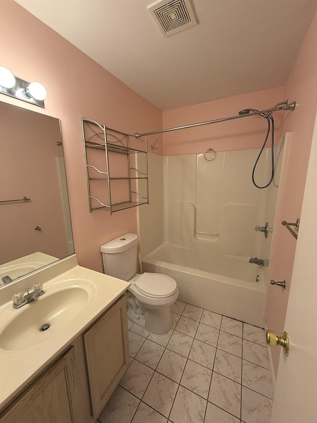 full bathroom featuring tile patterned flooring, shower / tub combination, vanity, and toilet