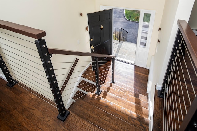 stairs with wood finished floors