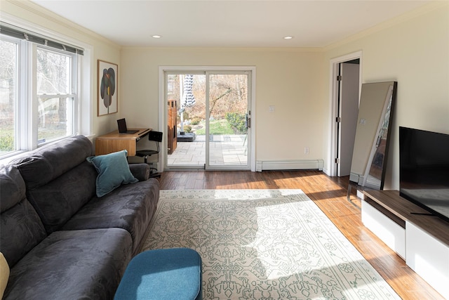 living area featuring light wood-style floors, a baseboard radiator, and ornamental molding