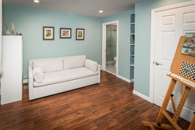 sitting room featuring dark wood-style floors, baseboard heating, baseboards, and recessed lighting