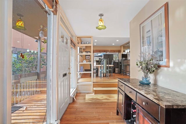 interior space featuring light hardwood / wood-style floors and a healthy amount of sunlight