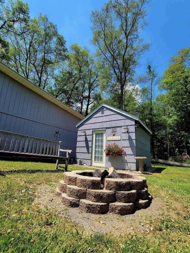 view of outbuilding featuring a yard