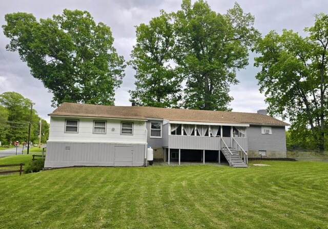 7 Red Top Rd, Wallkill, NY 12589 - back of house featuring a lawn, a sunroom, and stairway