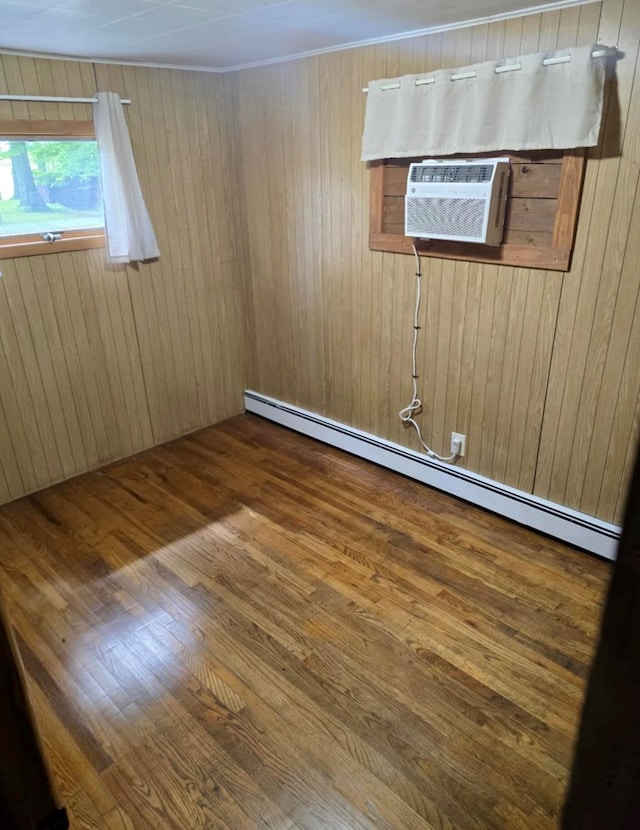7 Red Top Rd, Wallkill, NY 12589 - unfurnished room with baseboard heating, wood finished floors, and wooden walls