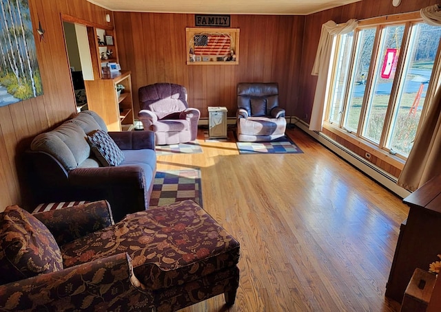 7 Red Top Rd, Wallkill, NY 12589 - living area with a baseboard radiator, wooden walls, wood finished floors, and crown molding