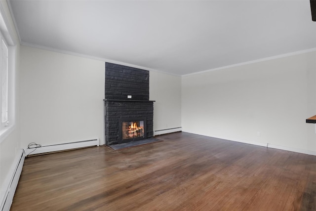 unfurnished living room with a fireplace, dark wood-type flooring, and a baseboard heating unit