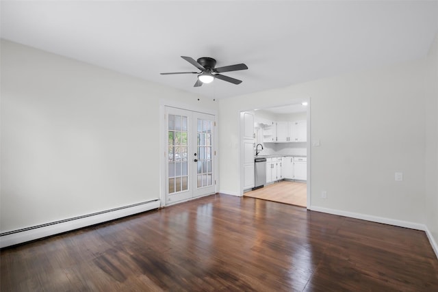 unfurnished living room featuring ceiling fan, sink, french doors, a baseboard heating unit, and hardwood / wood-style flooring