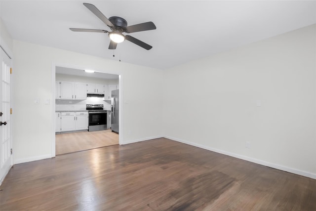 unfurnished living room with wood-type flooring and ceiling fan