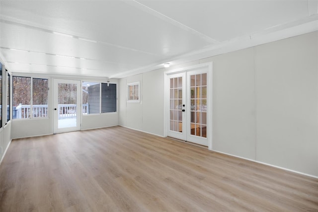 unfurnished sunroom with french doors