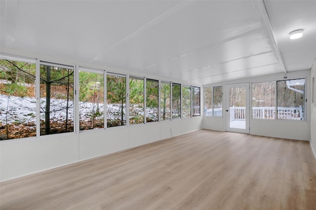 unfurnished sunroom with plenty of natural light