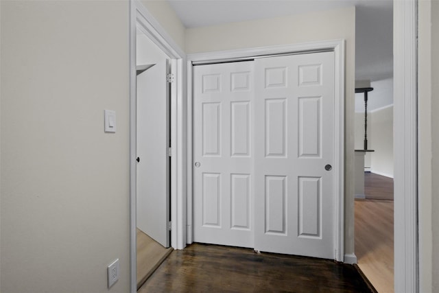 hall featuring dark wood-type flooring