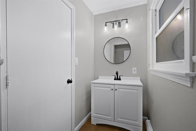 bathroom featuring hardwood / wood-style floors and vanity