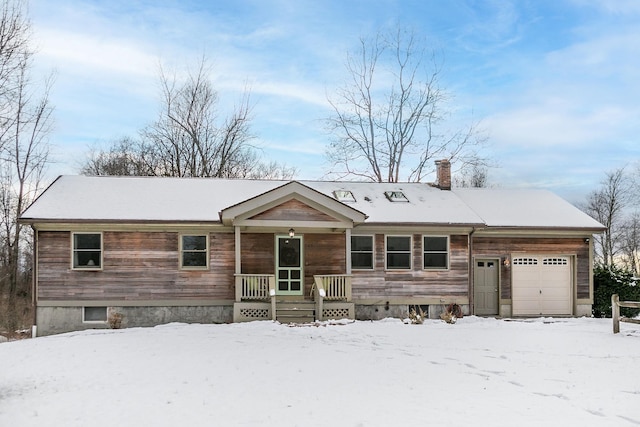 ranch-style home featuring a porch and a garage