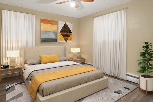 bedroom with ceiling fan, light hardwood / wood-style flooring, and a baseboard heating unit