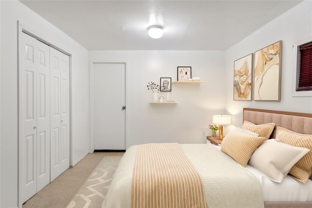 carpeted bedroom featuring a closet