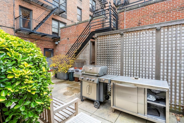 view of patio featuring a grill