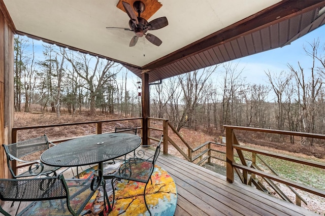 wooden deck featuring ceiling fan