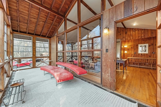 sunroom with wood ceiling and lofted ceiling with beams