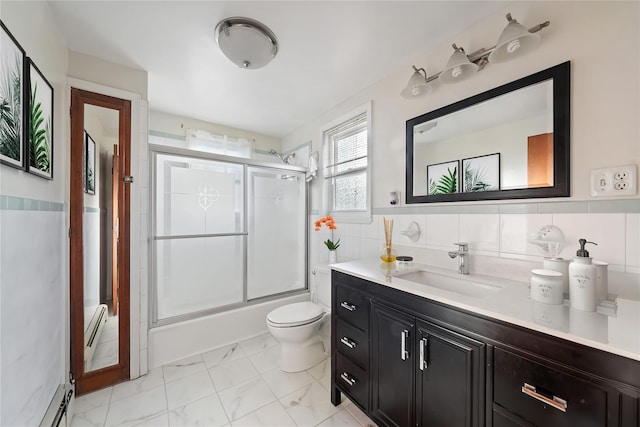 full bathroom with tasteful backsplash, vanity, tile walls, enclosed tub / shower combo, and toilet