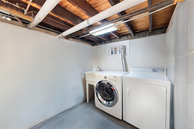 washroom with washer and dryer