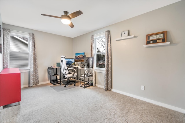 carpeted office with ceiling fan