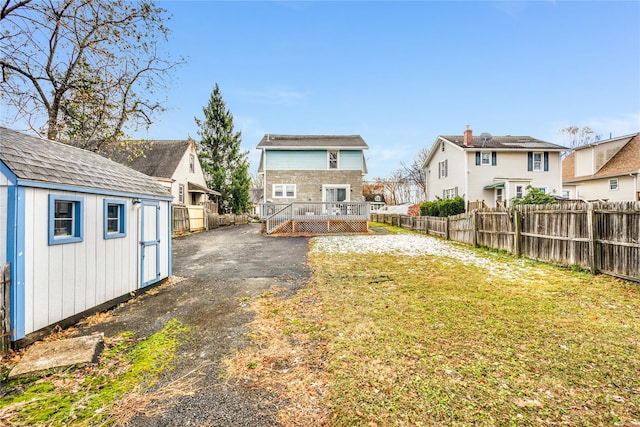 view of yard featuring an outbuilding and a deck