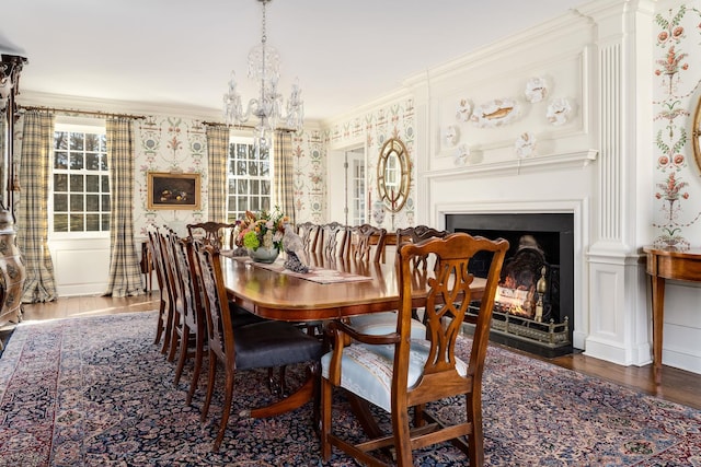 dining room featuring crown molding, dark hardwood / wood-style floors, and a notable chandelier