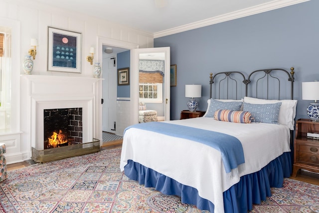 bedroom featuring crown molding and hardwood / wood-style floors