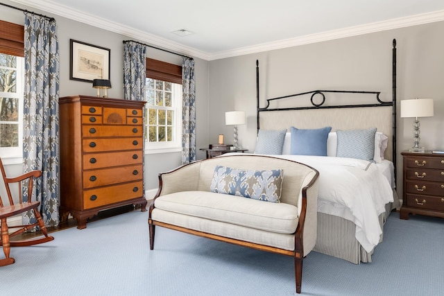 carpeted bedroom with ornamental molding